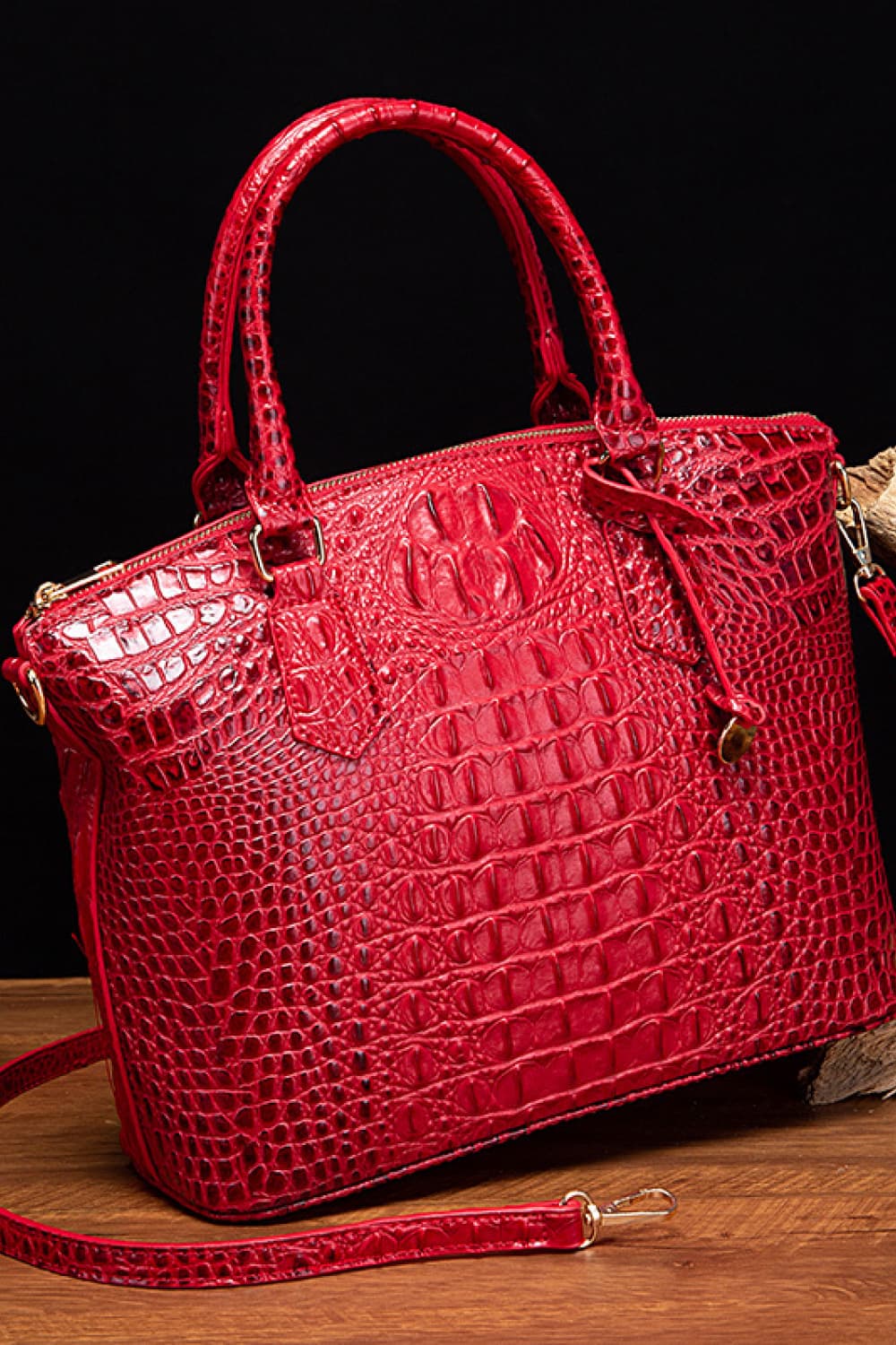 Croc-embossed vegan leather handbag in red with top handles and front emblem