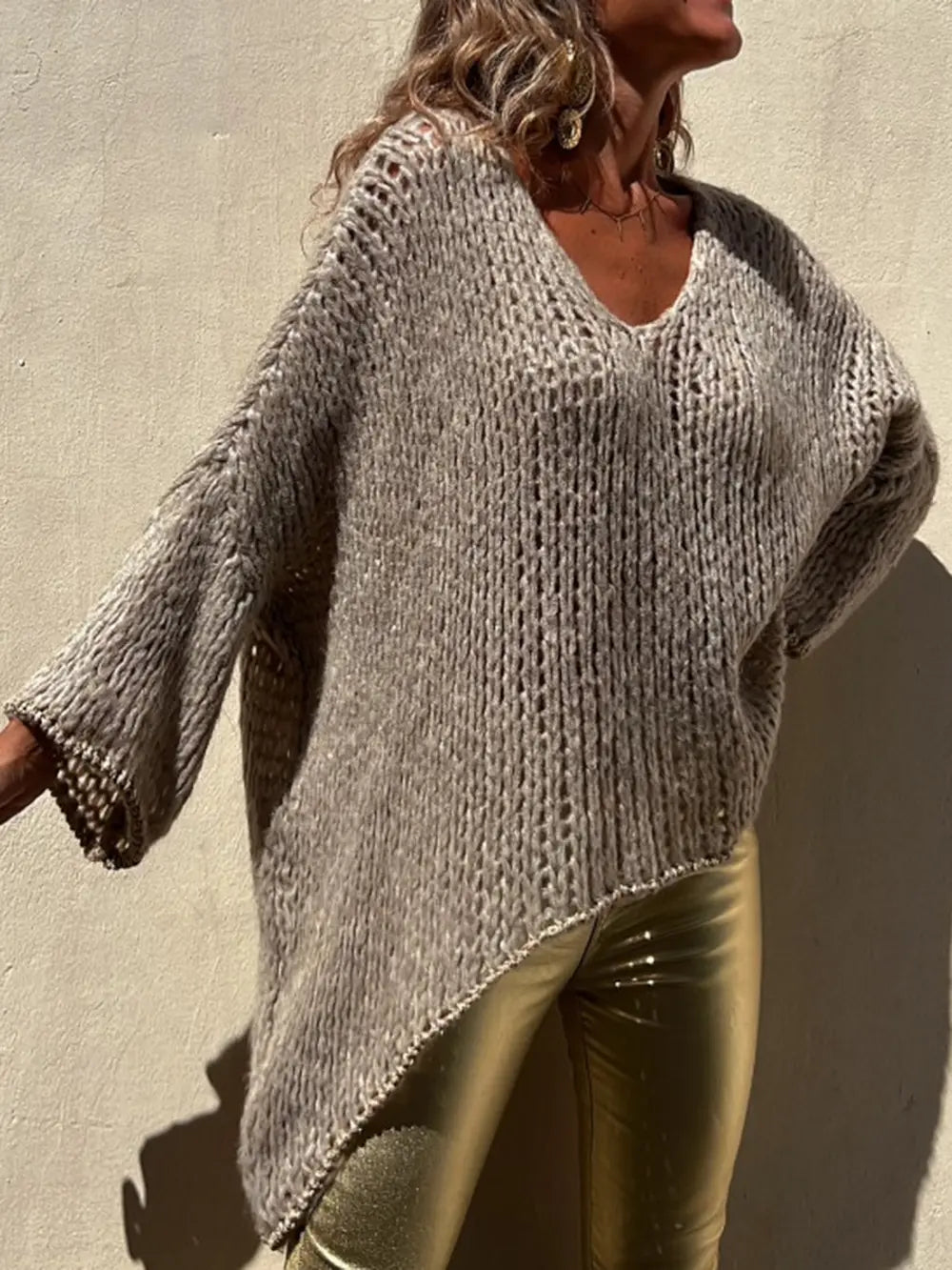 Camel textured knit V-neck long sleeve sweater with asymmetrical bottom and relaxed fit
