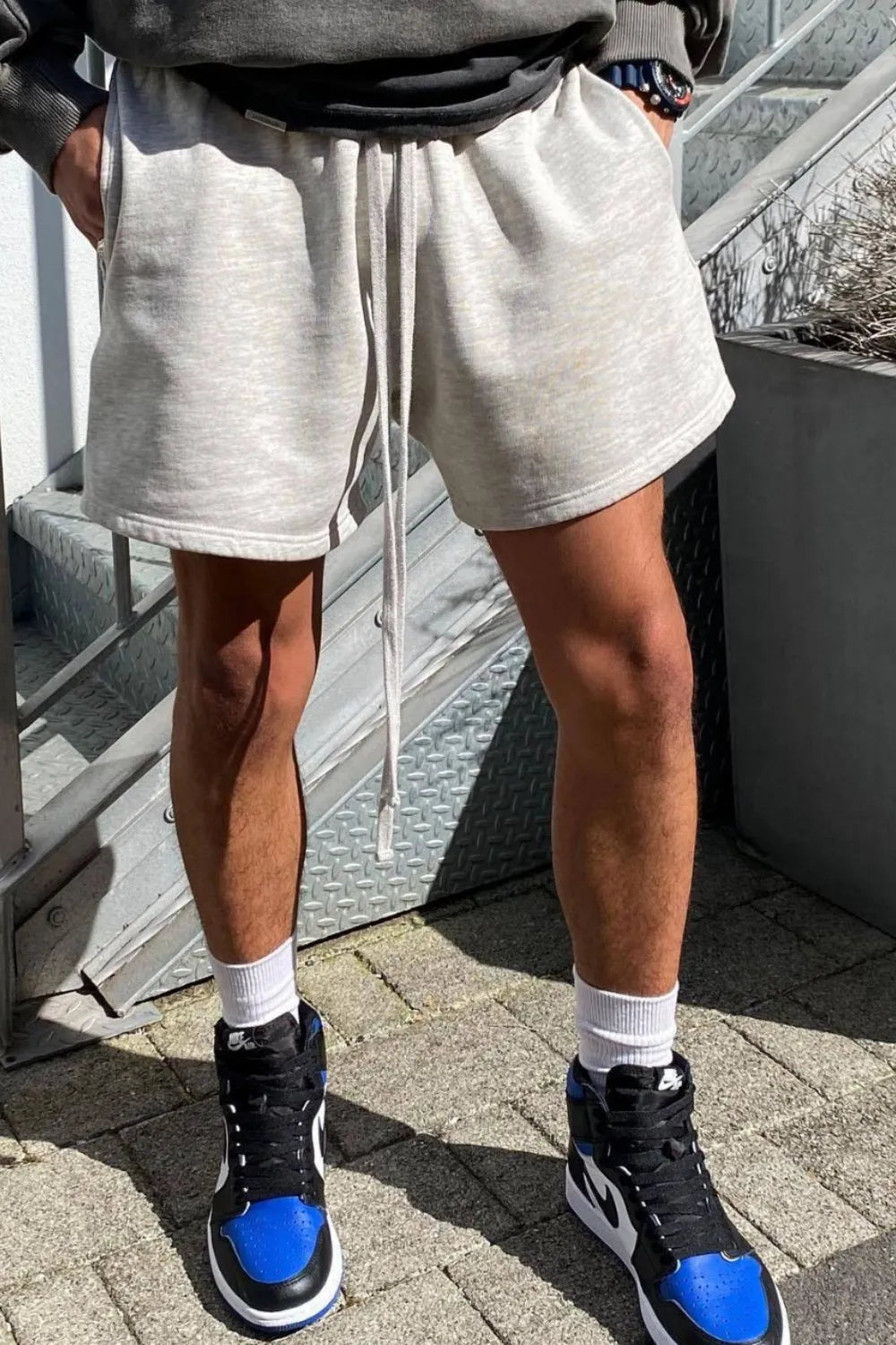 Light gray men's plus size drawstring shorts with long drawstring ties, above-knee