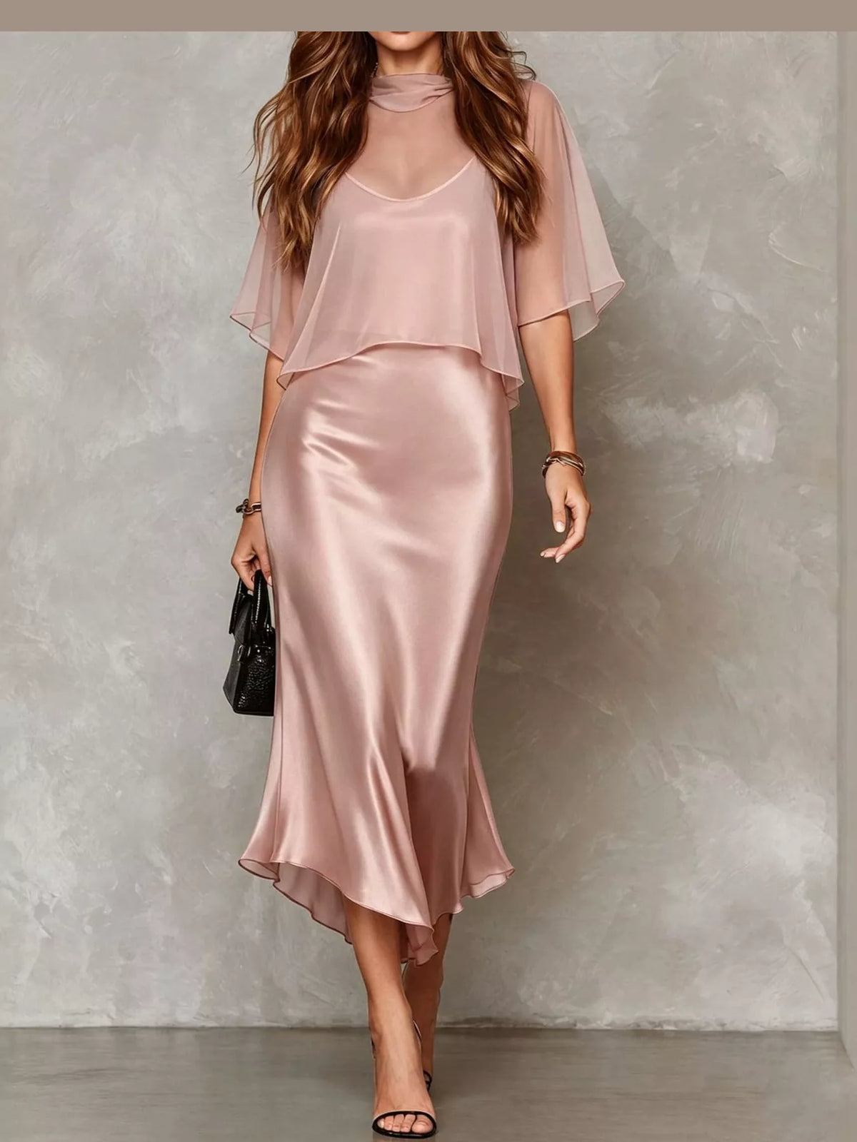 Pink satin slip midi dress with sheer cape sleeves and layered neckline