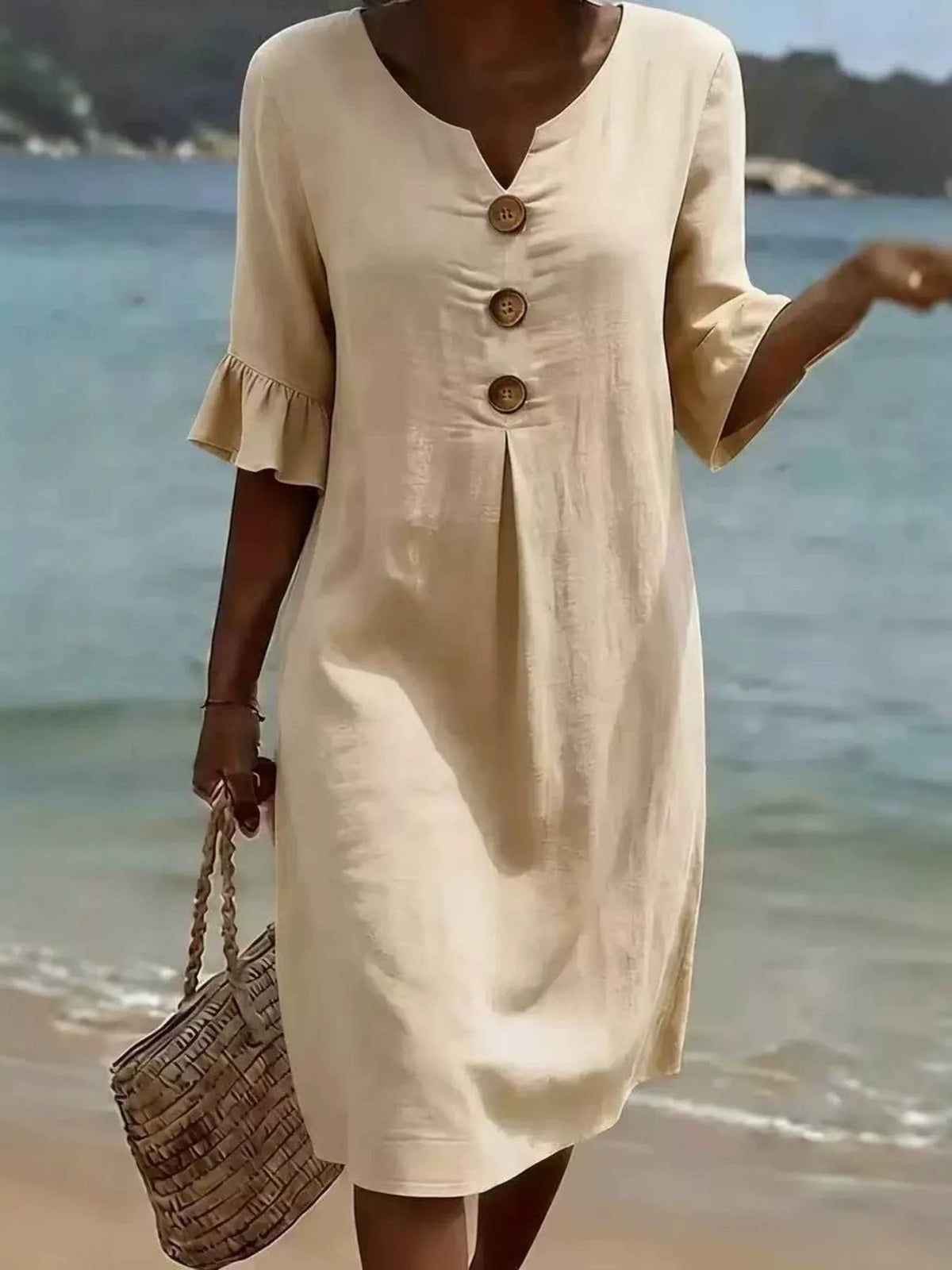 Cream button-front dress with ruffle sleeves, V-neck, gathered cuff detail