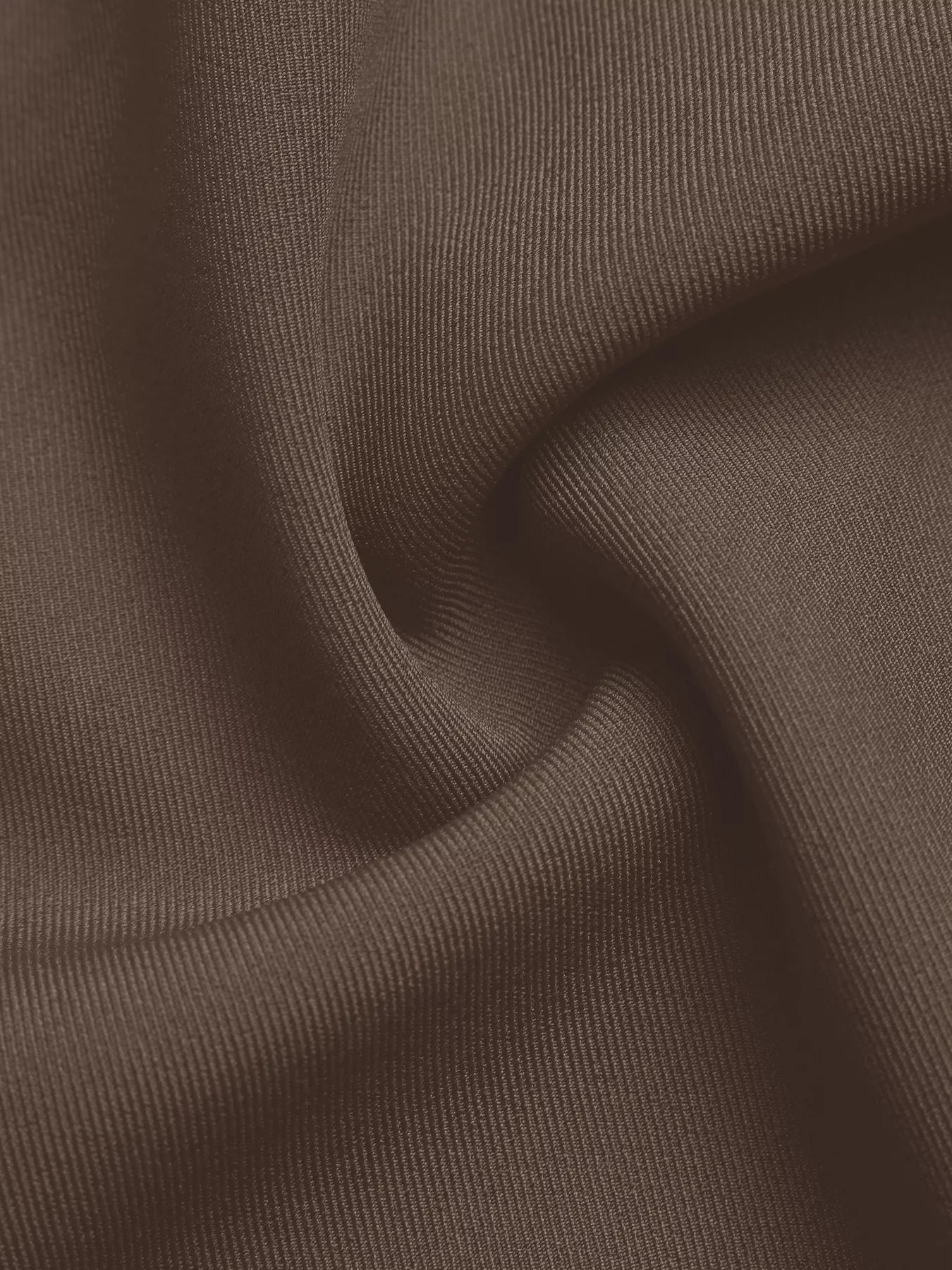 Brown woven fabric with subtle texture, close-up.