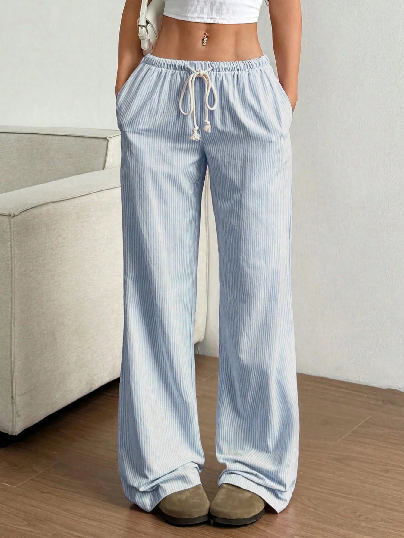 Light blue pinstripe wide-leg pants with elastic waistband and center drawstring