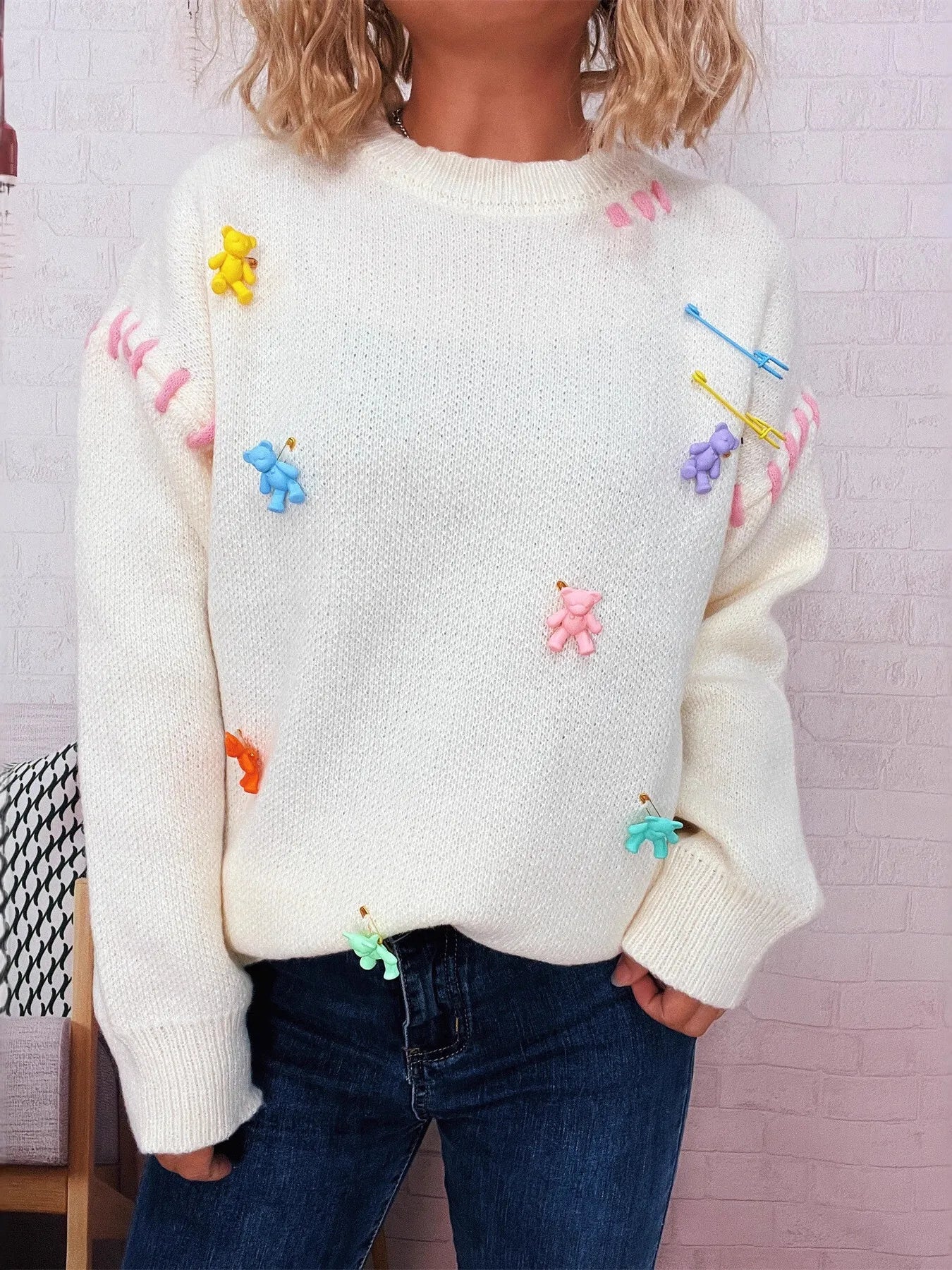 Cream round-neck sweater with multicolor bear appliques, long sleeves