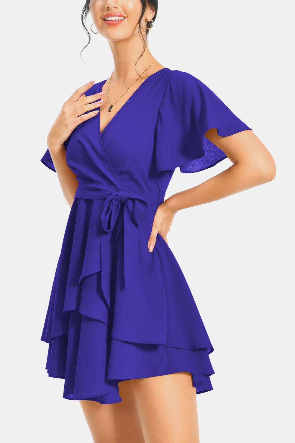 Royal blue surplice neck flutter sleeve dress with waist tie and tiered ruffle hem