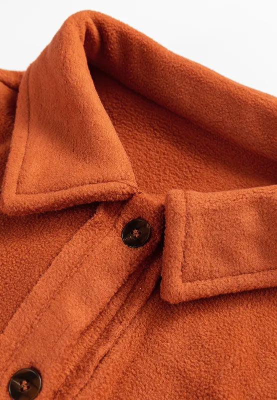 Plaid button-up long sleeve jacket collar and button placket detail in rust orange