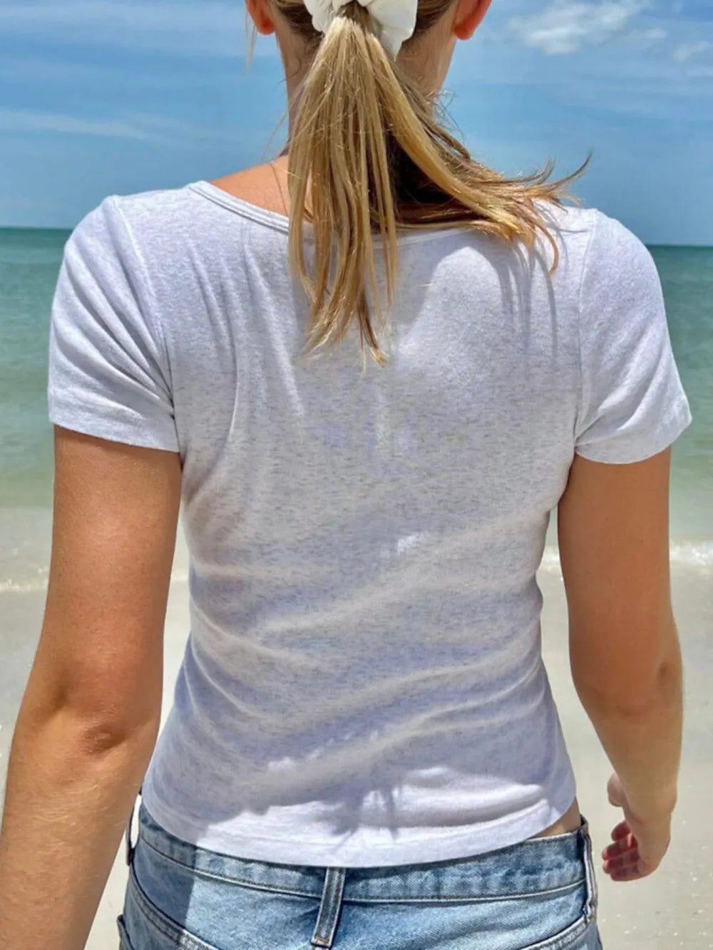 Light gray short-sleeve T-shirt, back view with curved neckline