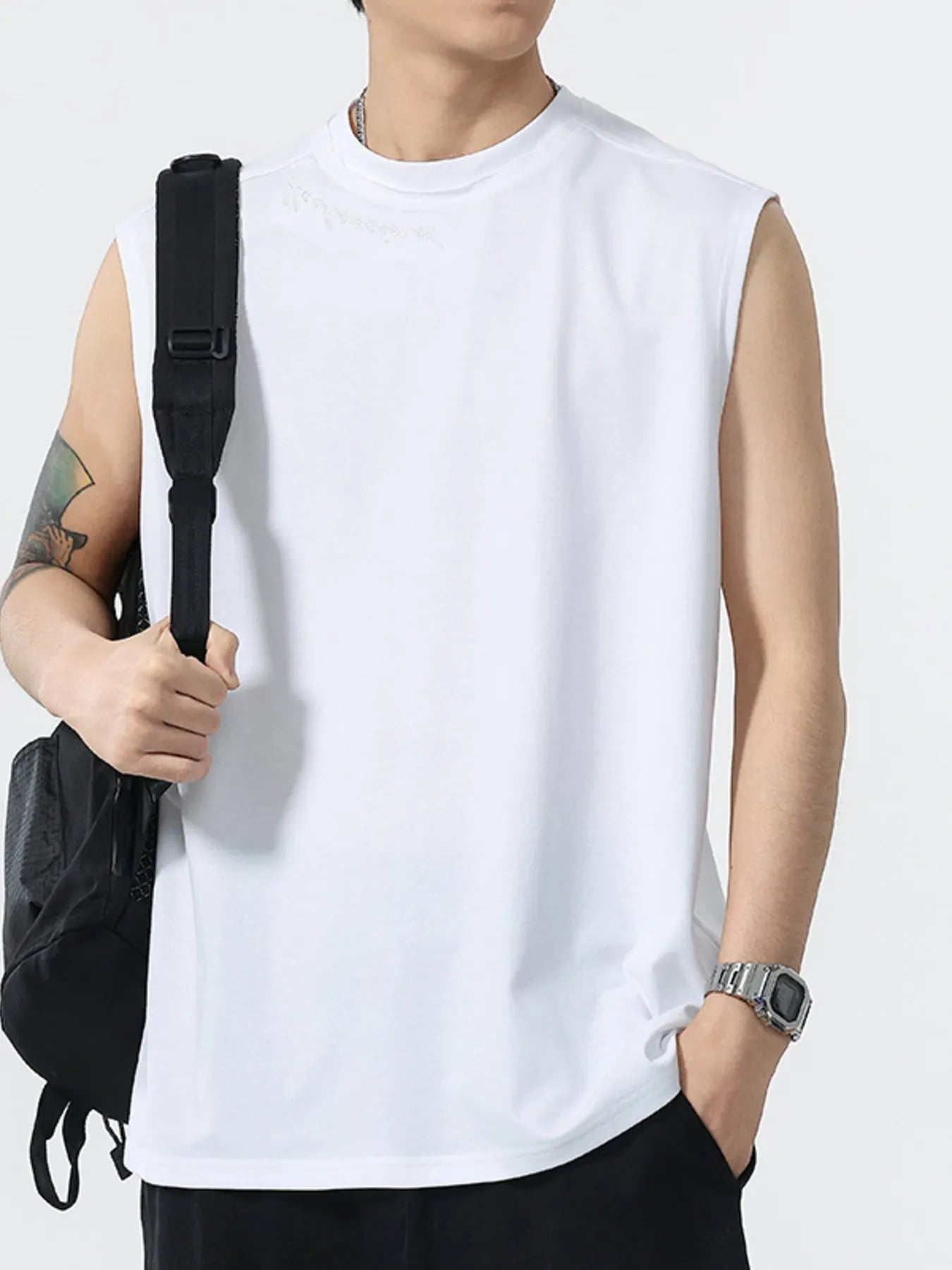 White sleeveless round-neck tank top for men, clean front hem