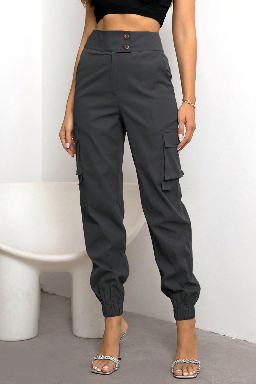 High-waist cargo pants, dark black with cargo side pocket and elastic ankle jogger cuffs