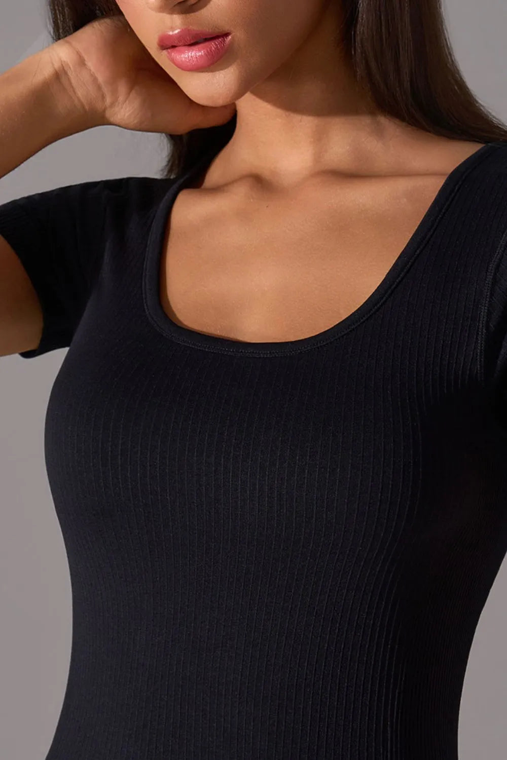Black square-neck active t-shirt neckline and ribbed knit texture