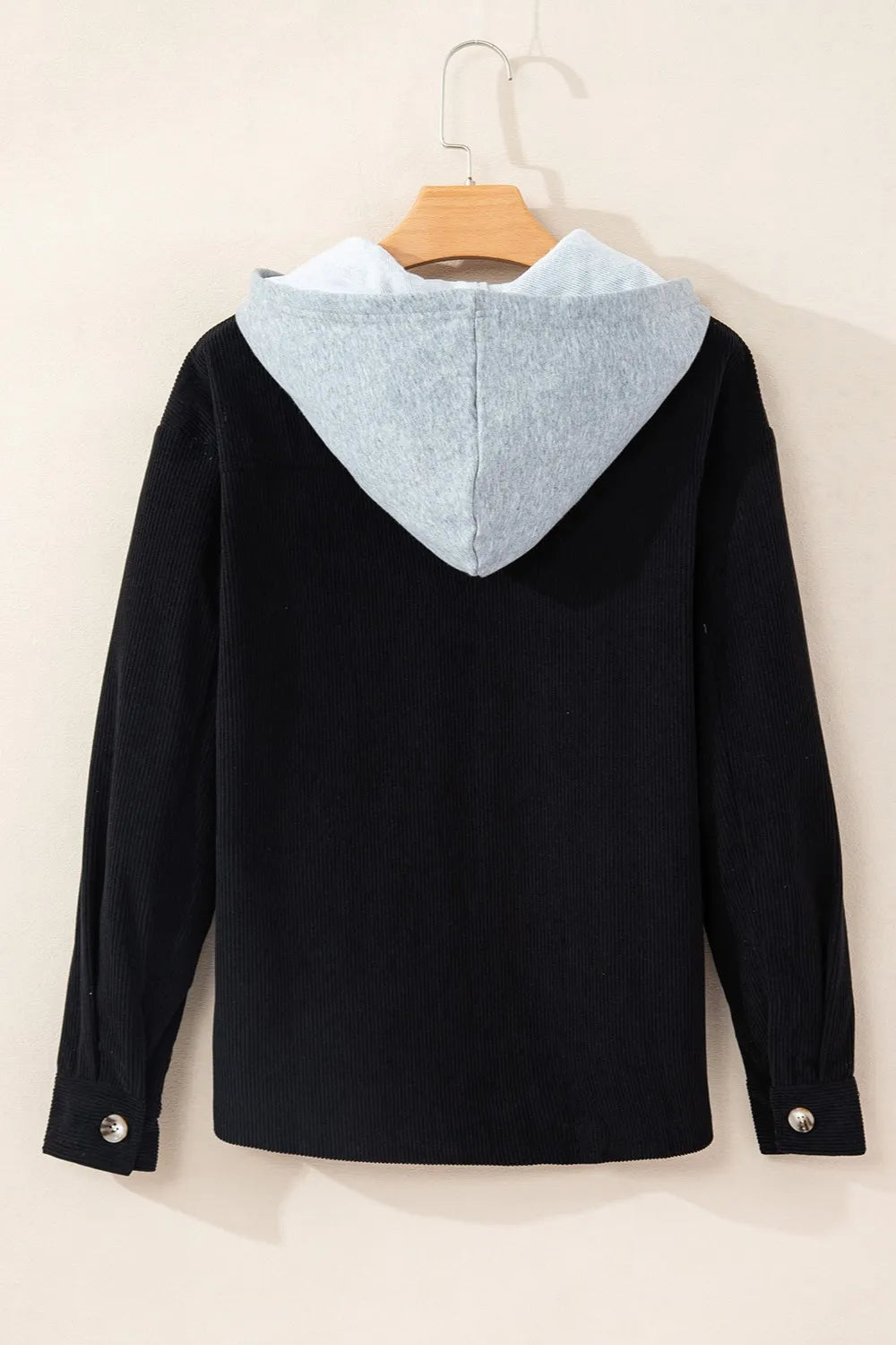 Black hooded jacket with long sleeves, gray-lined hood, button front and drawcord.