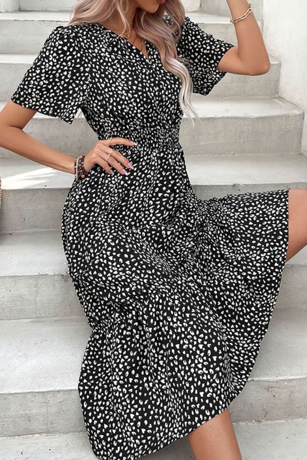 Black leopard print midi dress with short sleeves, V-neck and ruched waist tiered skirt