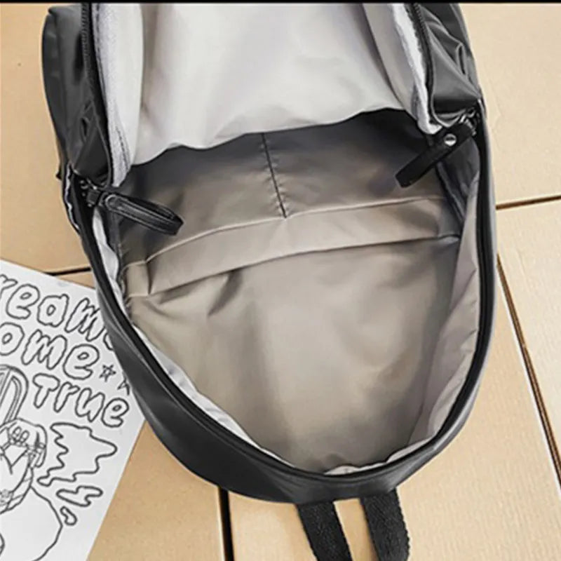 Black vegan leather zip backpack interior lining and top zipper opening