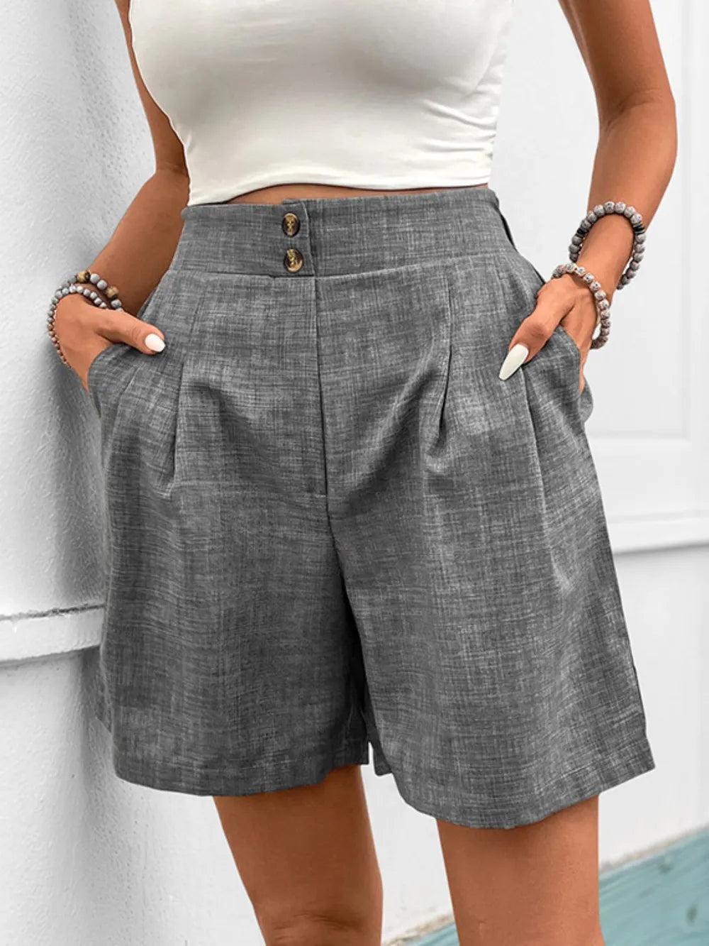 Gray frill shorts with pockets, button front and pleated seams