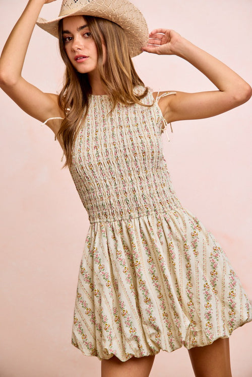 Ivory floral puff-sleeve dress with gathered waist and tied shoulder straps