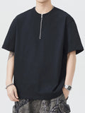 Black oversized half-zip T-shirt, short sleeves with central zipper