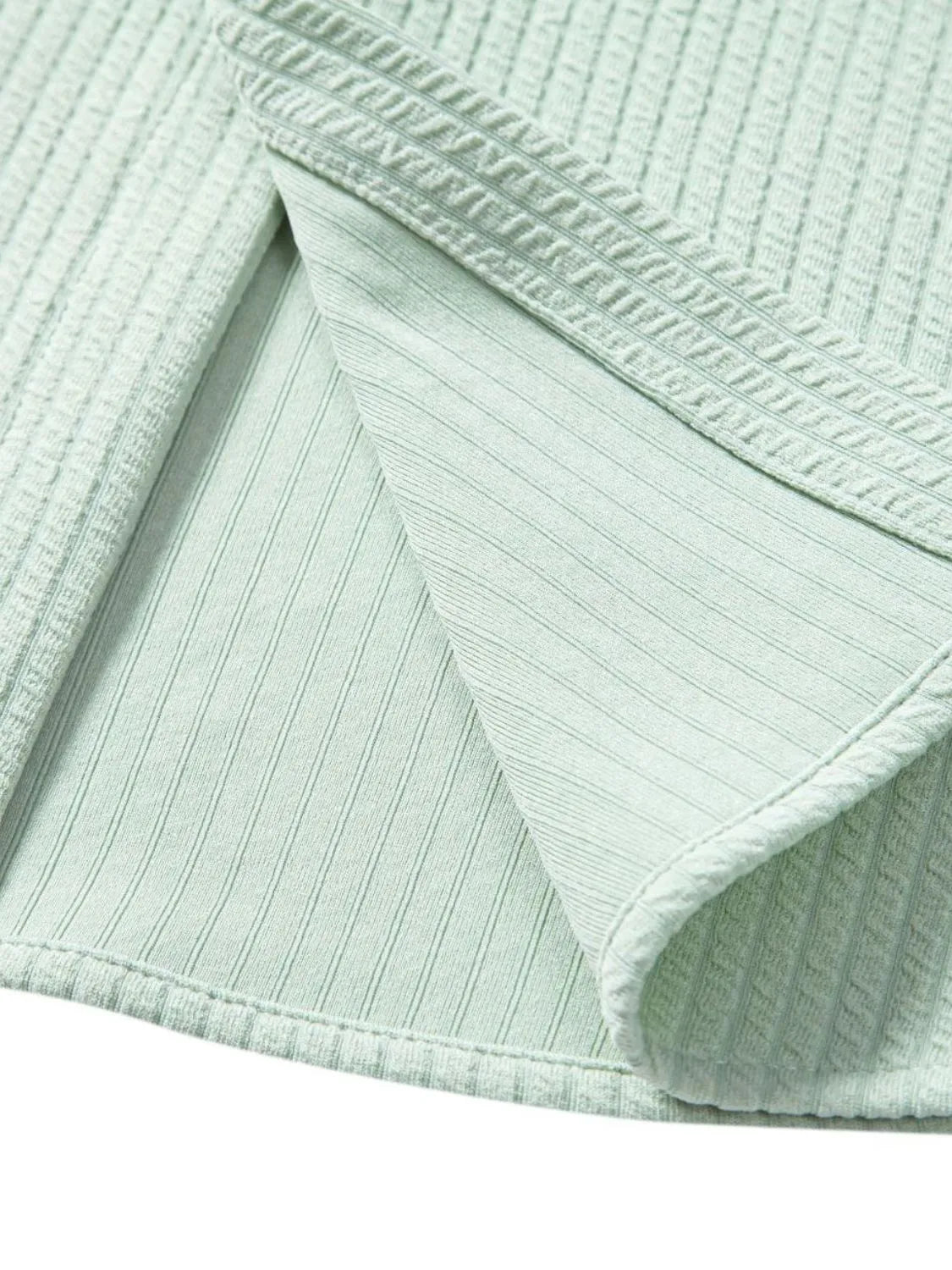 Mint green ribbed shorts interior seam and stitched hem