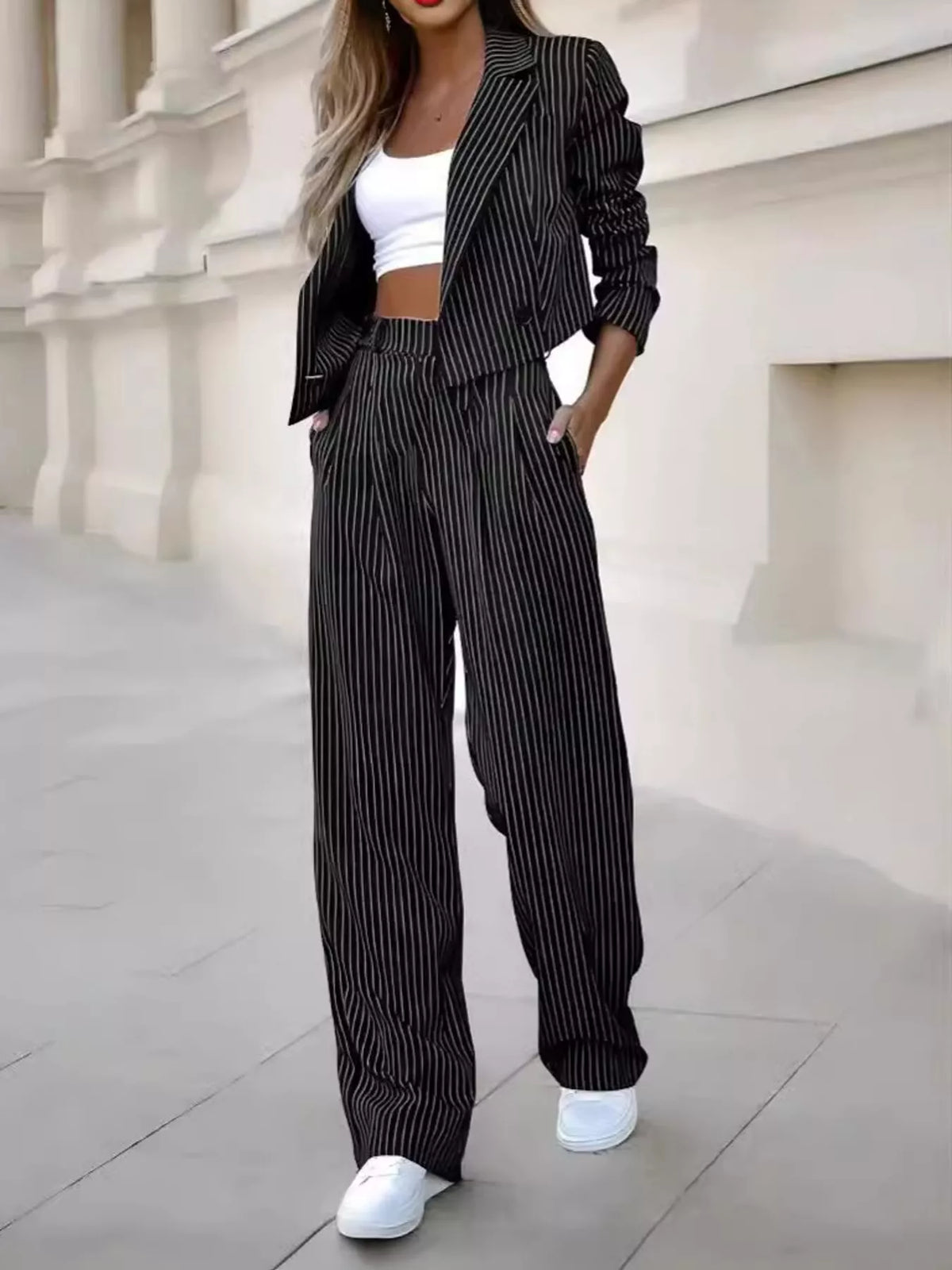 Black pinstripe cropped blazer and wide-leg pants set with matching belt
