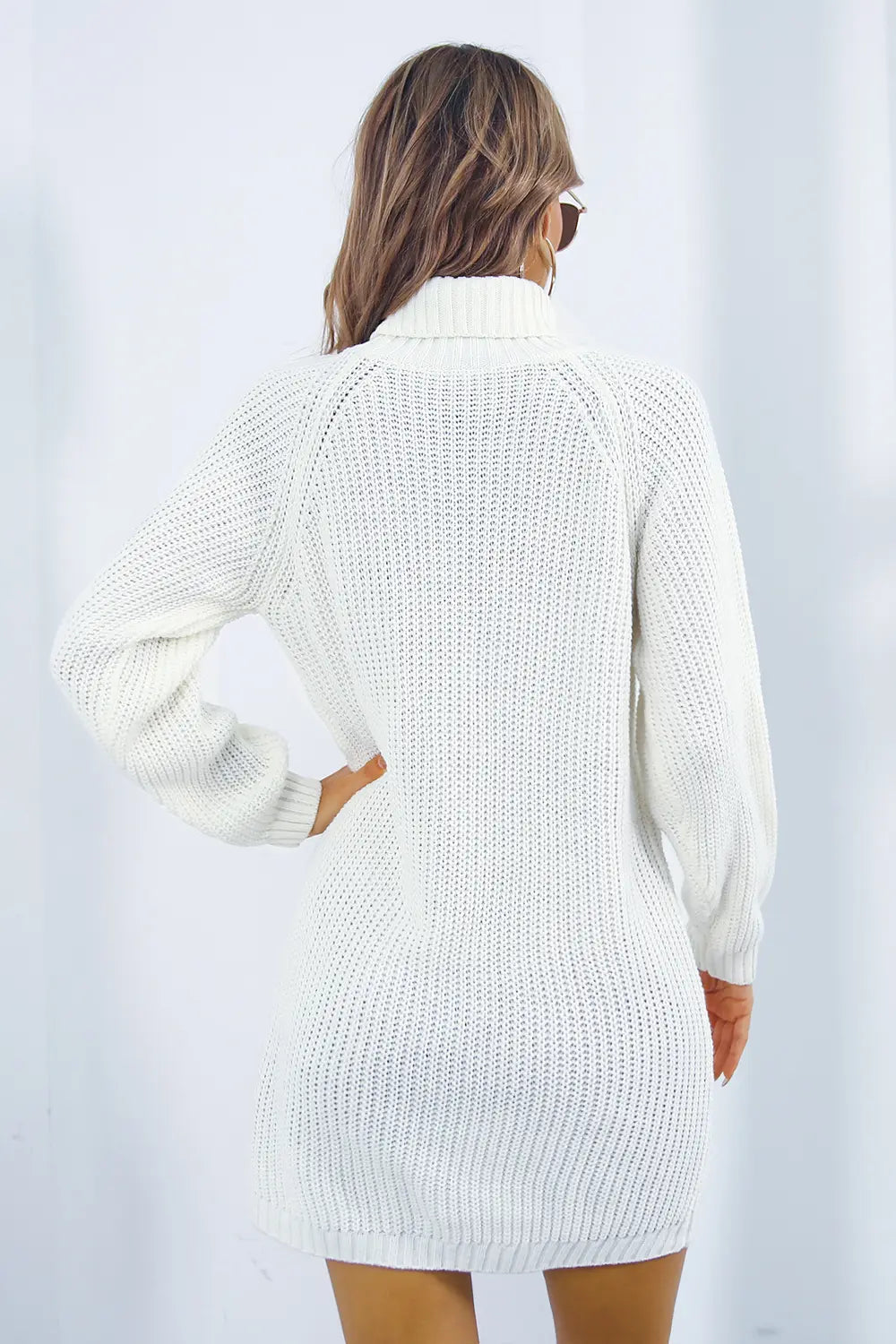 White knit turtleneck sweater dress, long sleeves, back view with ribbed knit