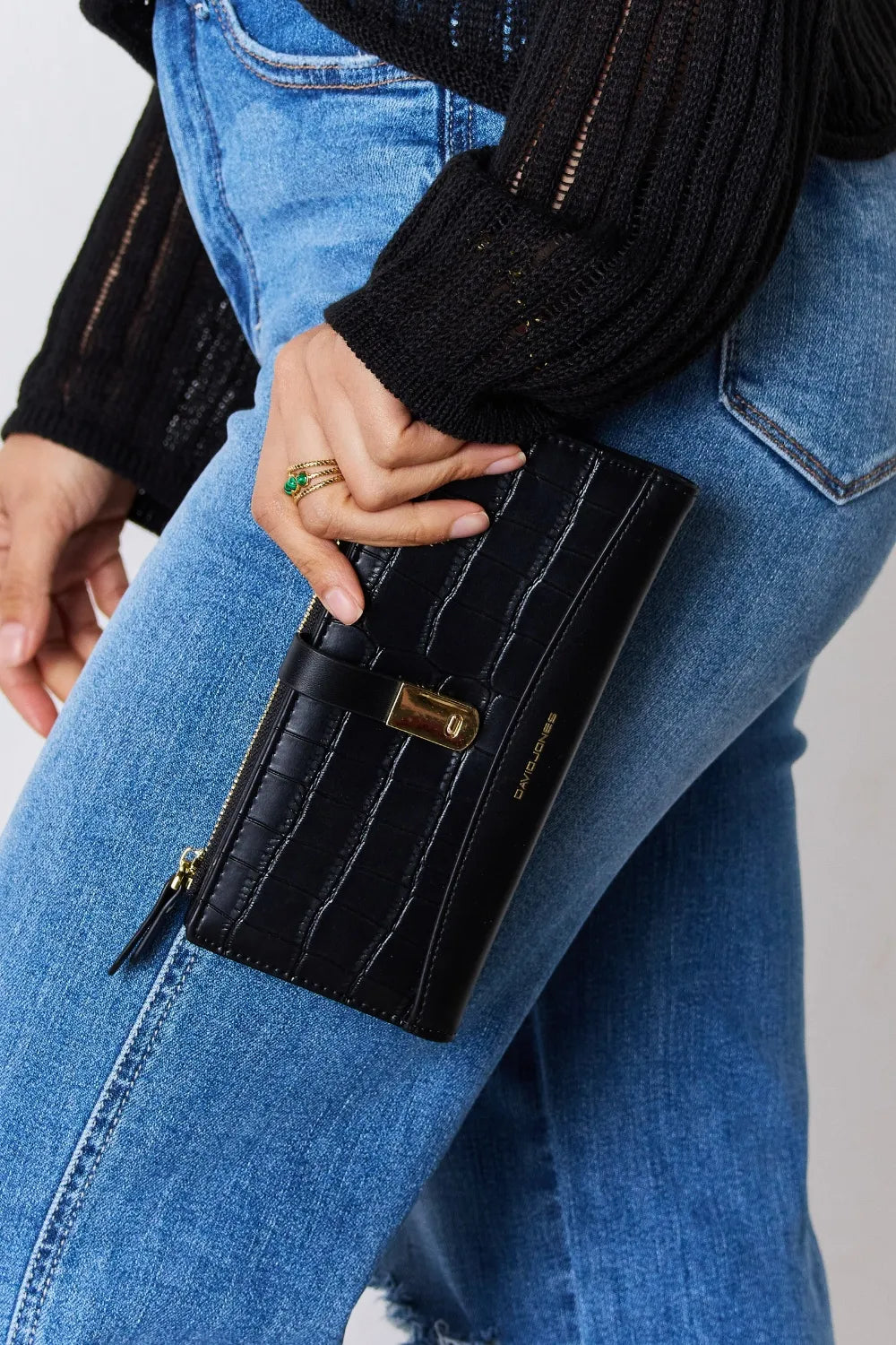 Black textured PU leather wallet with gold-tone zipper and front tab closure.