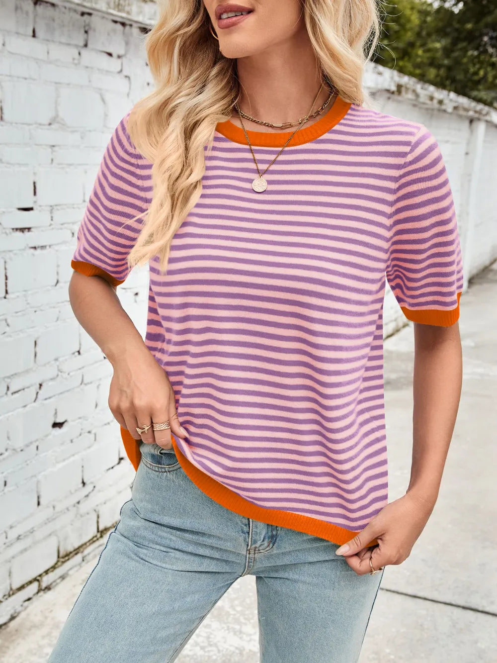 Striped knit top, purple-and-white stripes with orange ribbed round neck and sleeve cuffs