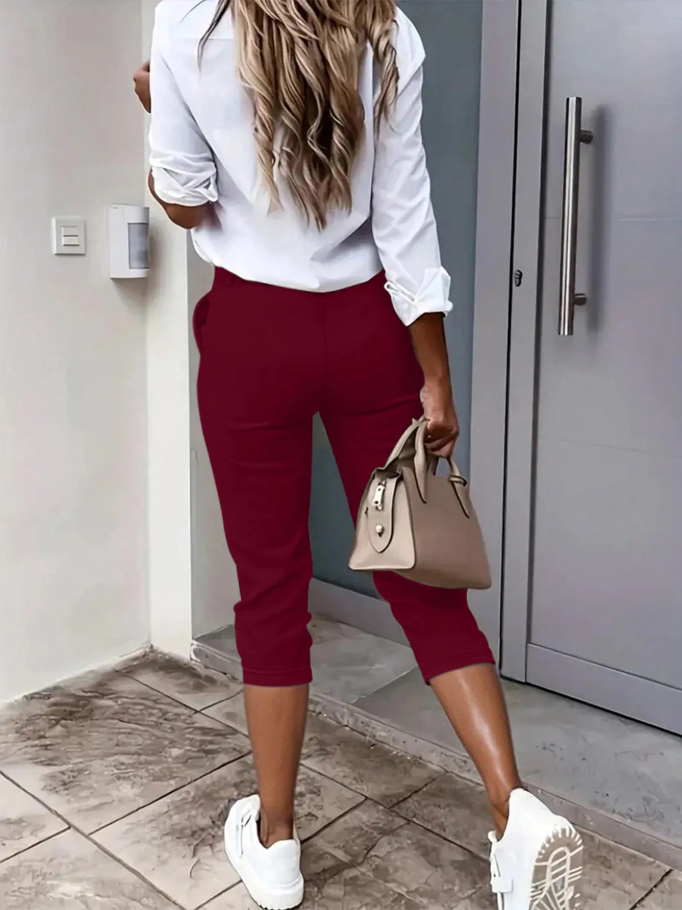 Burgundy pleated detail capri pants with front pockets and belt loops
