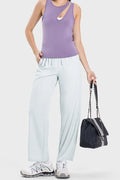 Active pants with drawstring waist and side pockets in light mauve, wide-leg