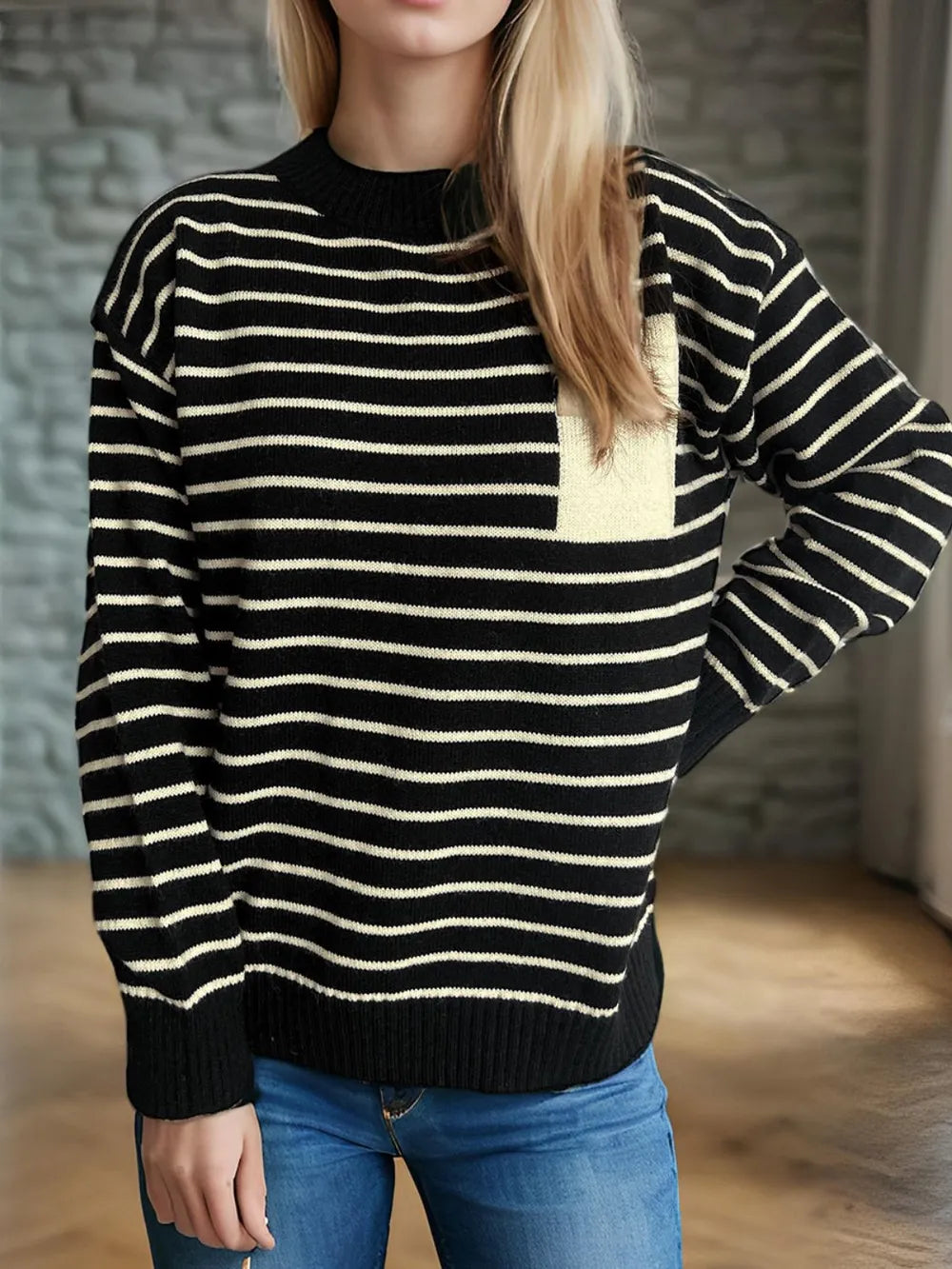 Striped mock neck long-sleeve sweater with black base and cream horizontal stripes