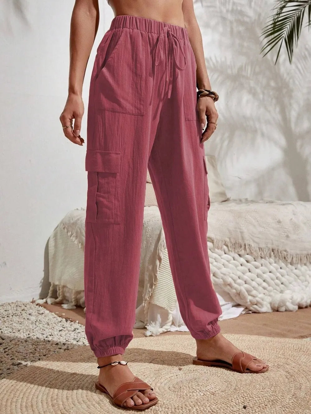 Burgundy drawstring cargo joggers with side cargo pockets and elastic cuffs