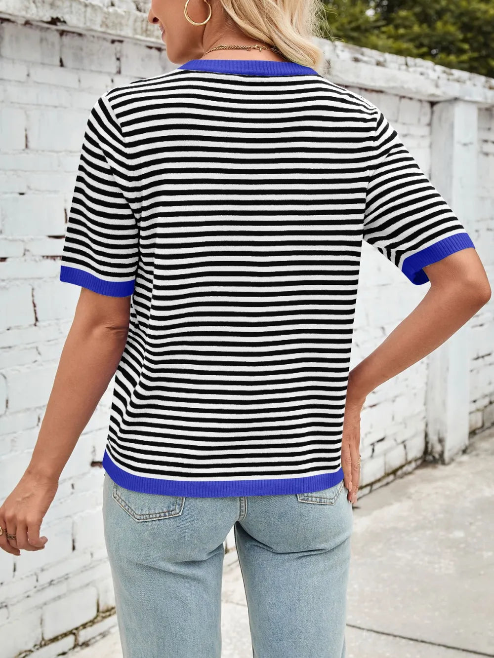 Striped knit top, black-and-white horizontal stripes with blue ribbed trim at sleeves