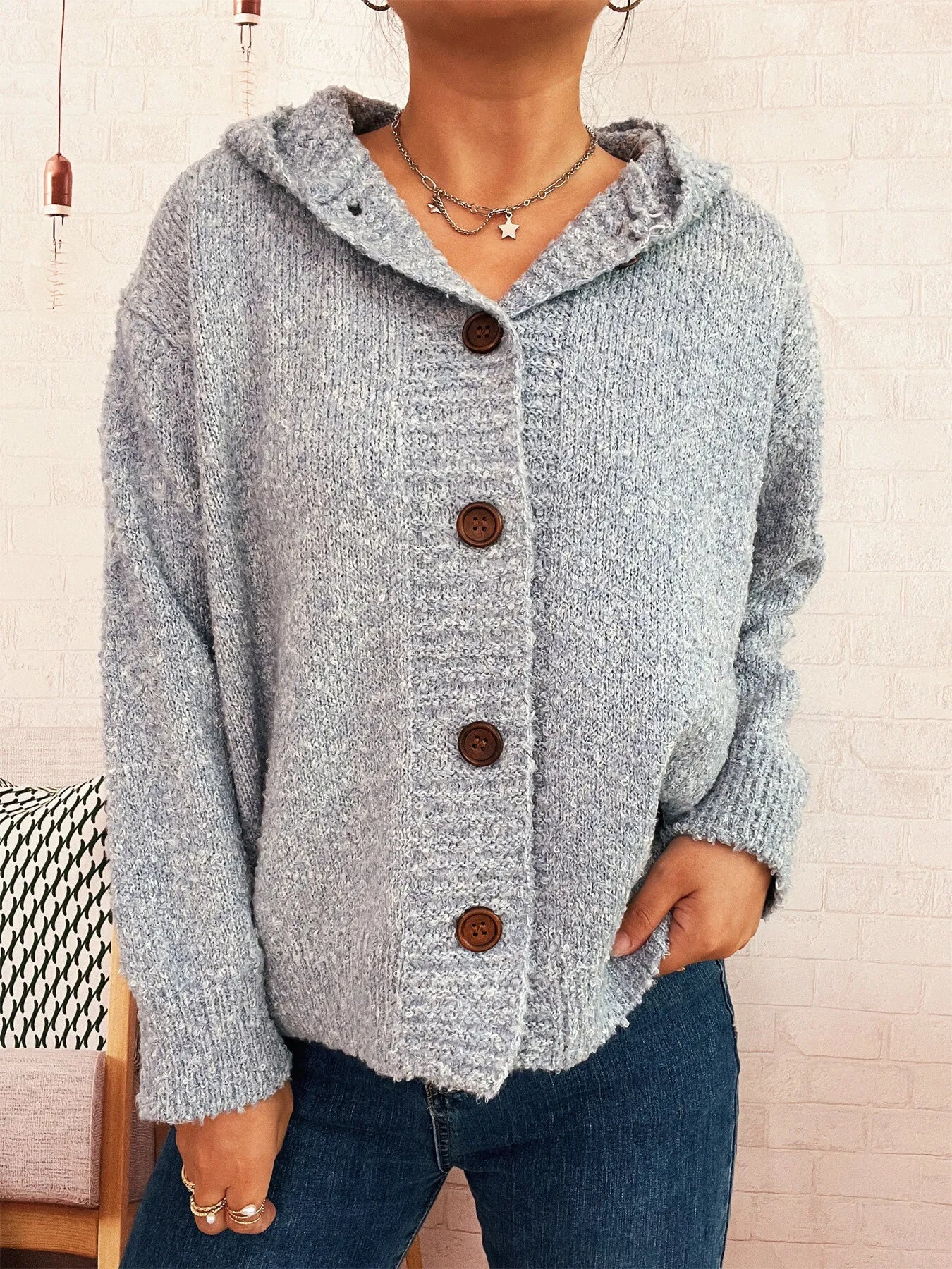 Cozy hooded cardigan, heather gray knit with dark brown button front.