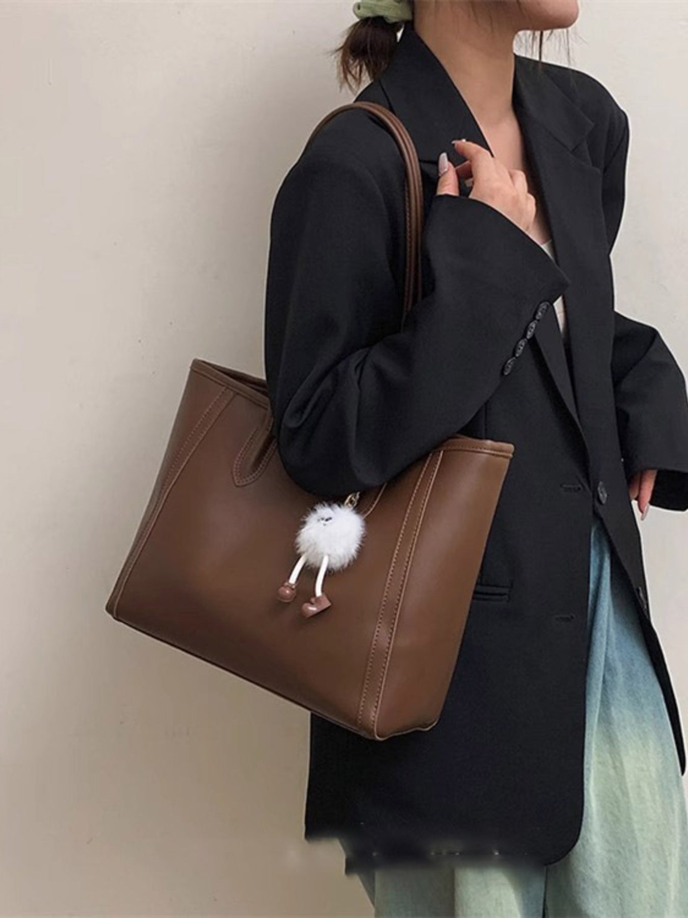 PU leather shoulder bag in brown with white fluffy pom-pom charm, large size