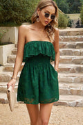 Dark green strapless romper with layered ruffles and smocked waist