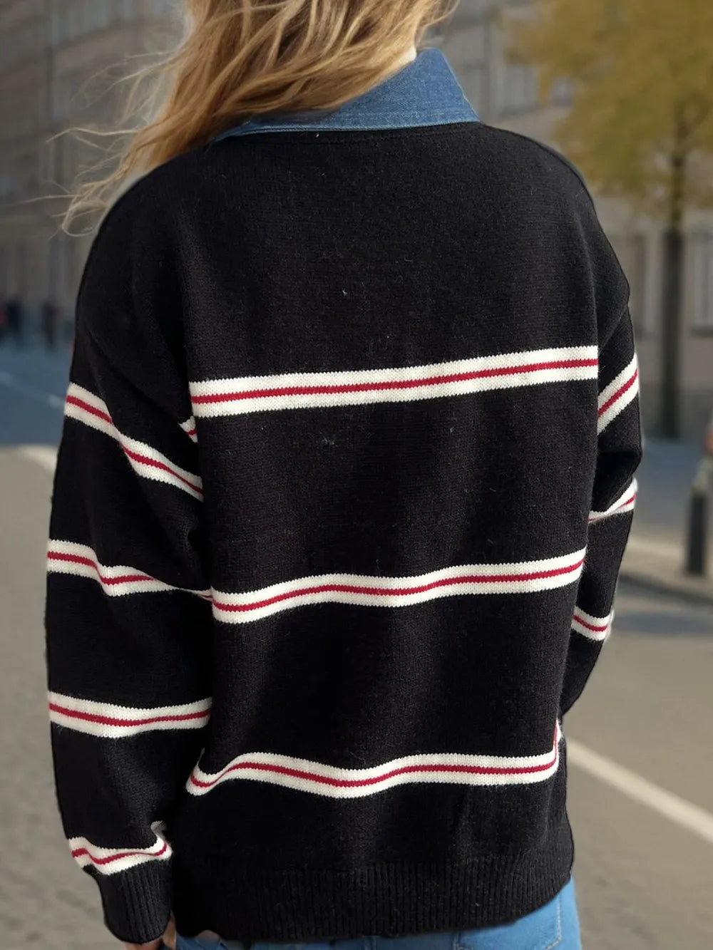 Black round-neck long-sleeve sweater with red and white horizontal stripes on back