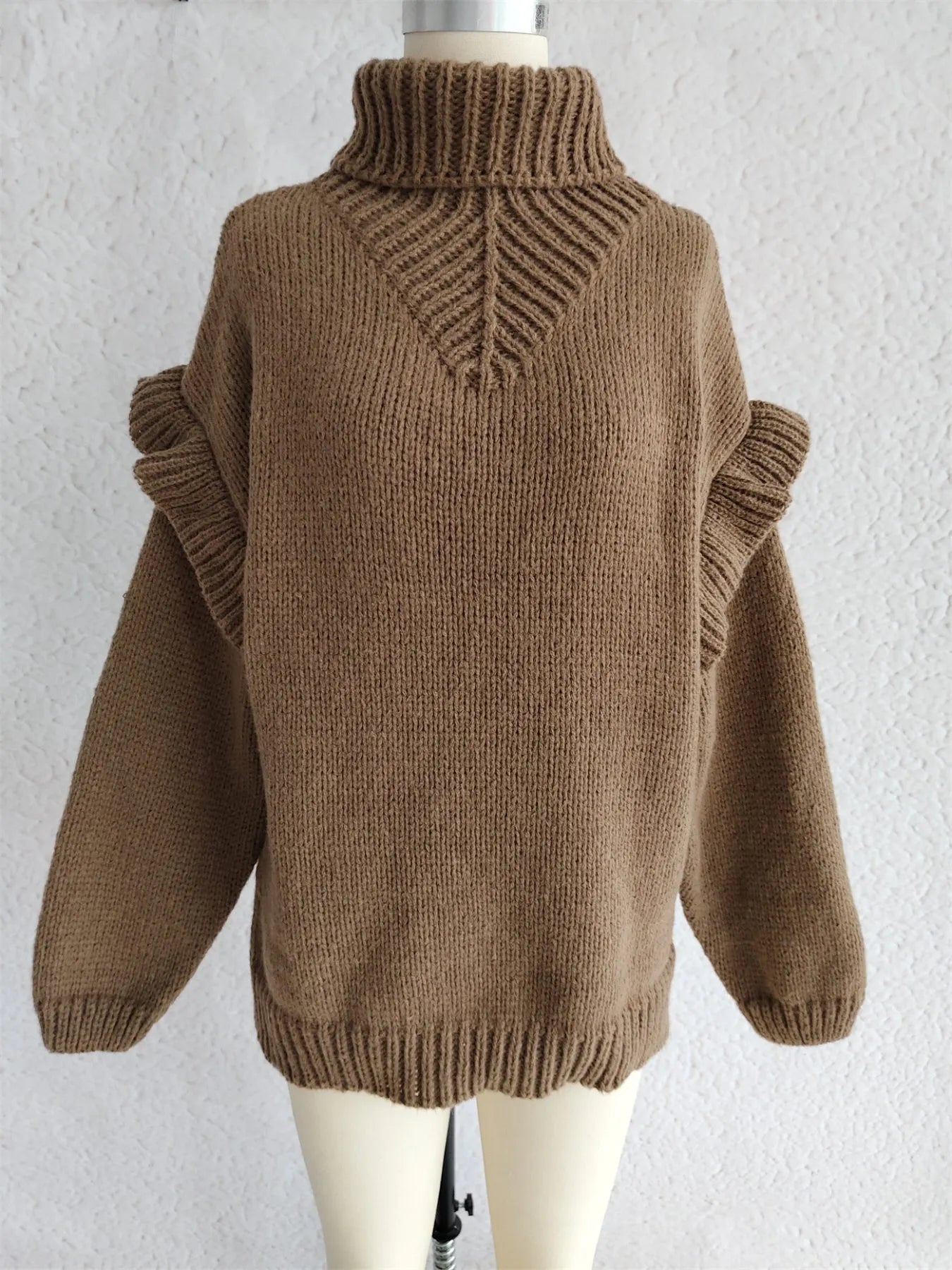 Brown ruffled turtleneck long-sleeve knit sweater on mannequin, back view