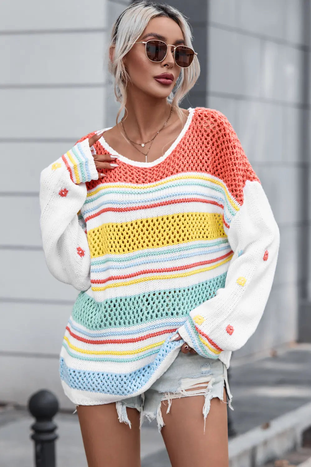 Openwork striped sweater with round neck; orange knit and yellow, blue, green stripe rows