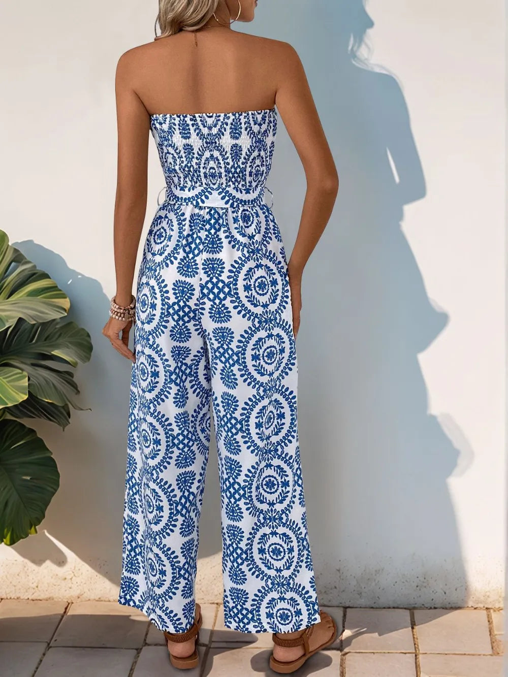 Blue tube wide-leg jumpsuit with navy medallion print and smocked bodice