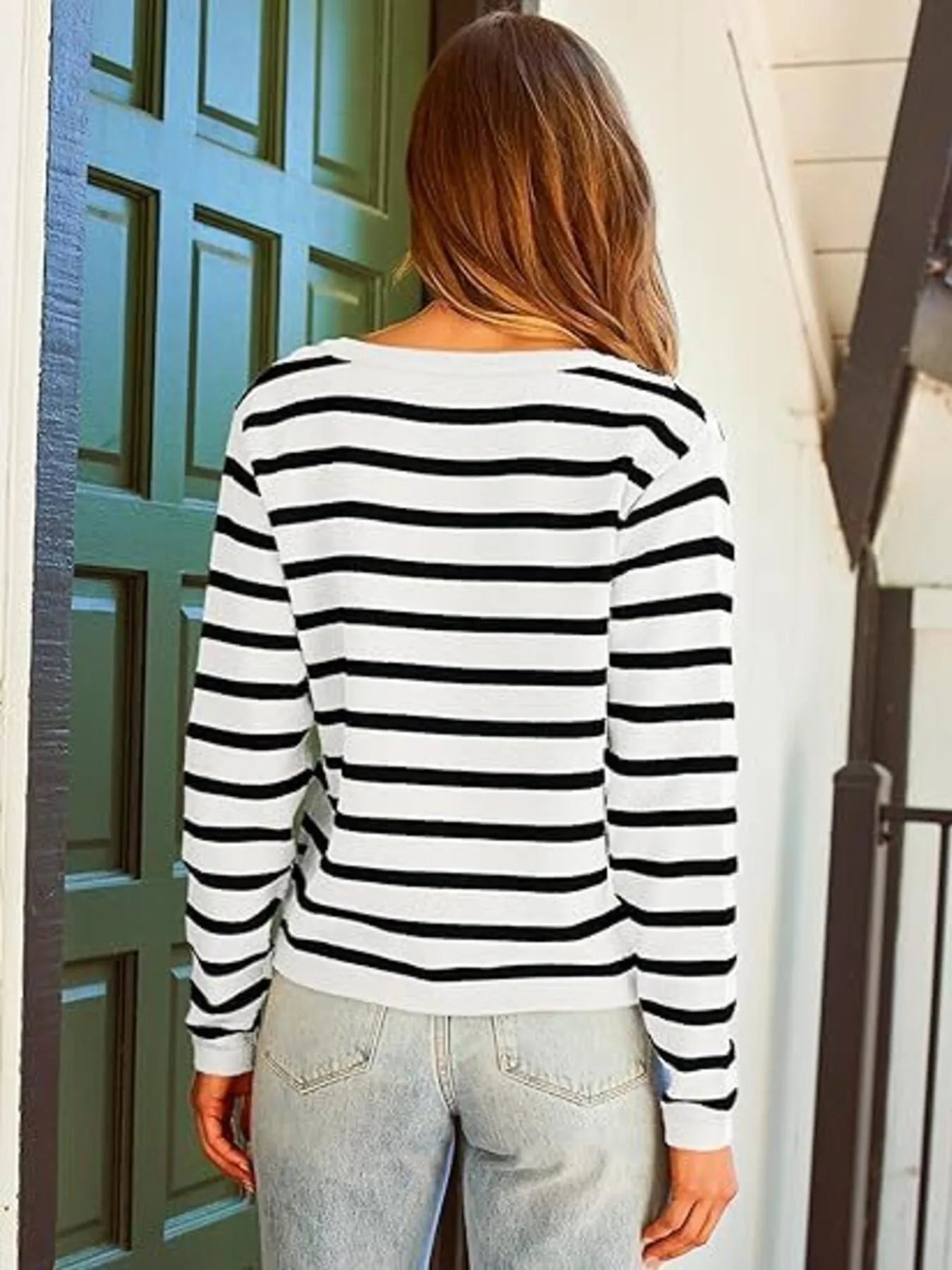 White and black striped cardigan from the back with long sleeves