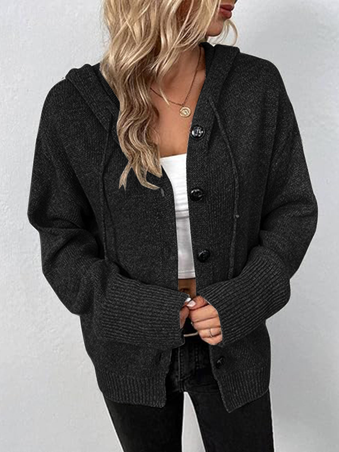 Black hooded button cardigan sweater with long sleeves and front button placket
