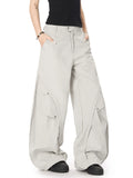 Light gray oversized wide-leg cargo pants with flap pockets and belt loops
