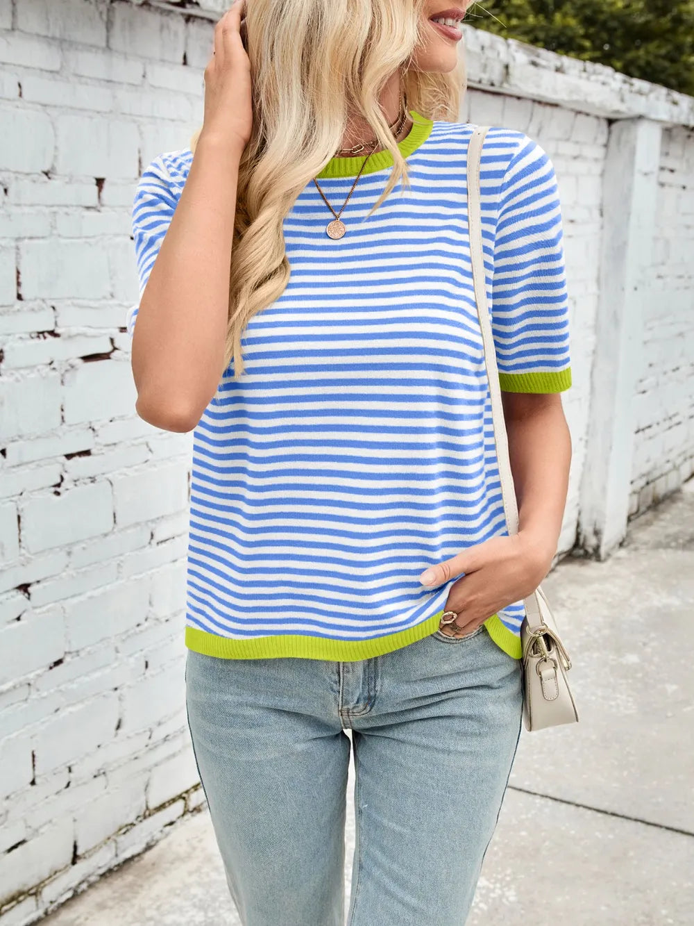 Striped knit top with lime green ribbed trim, round neck, and half sleeves