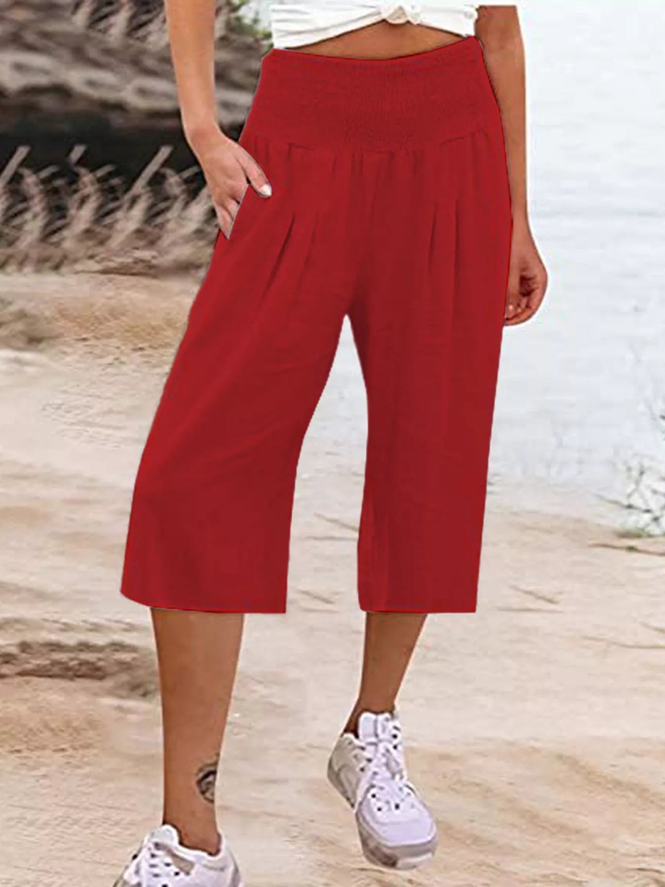 Smocked wide-leg capri pants in red, gathered elastic waist and wide cropped legs