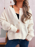 White cardigan with floral embroidery, button front, ribbed cuffs and hem