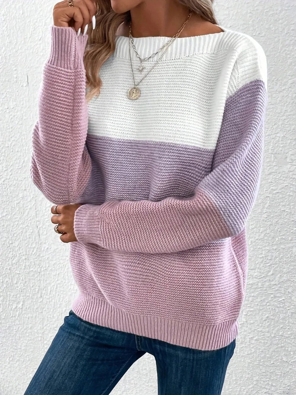 Color block knit sweater in white and lilac/pink, boat neck, long sleeves.