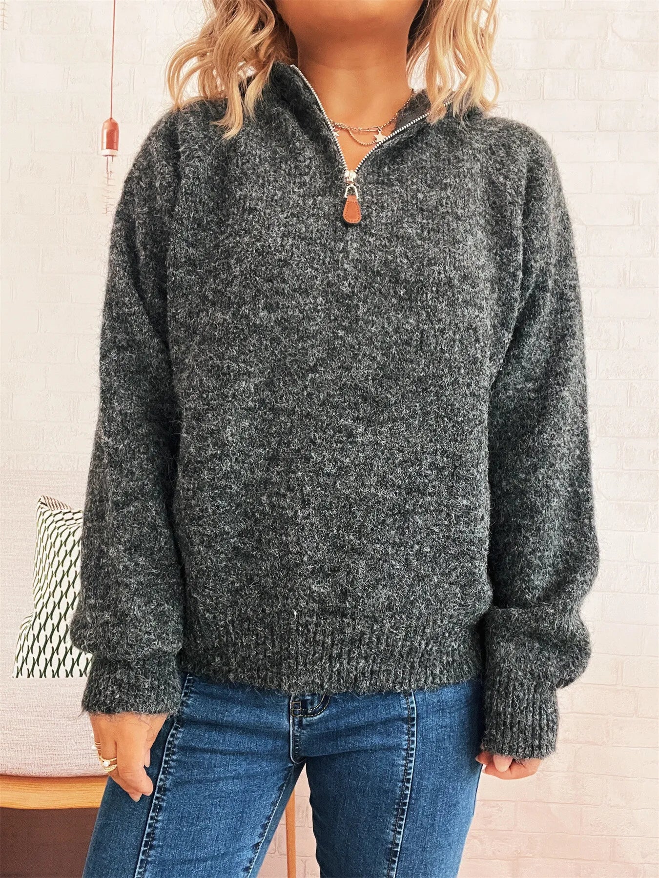 Dark gray quarter-zip knit sweater with ribbed hem and cuffed sleeves