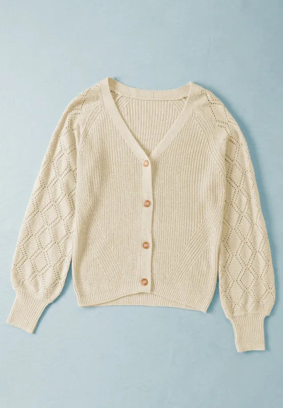 Cream openwork V-neck button-up cardigan knit with long sleeves and button placket