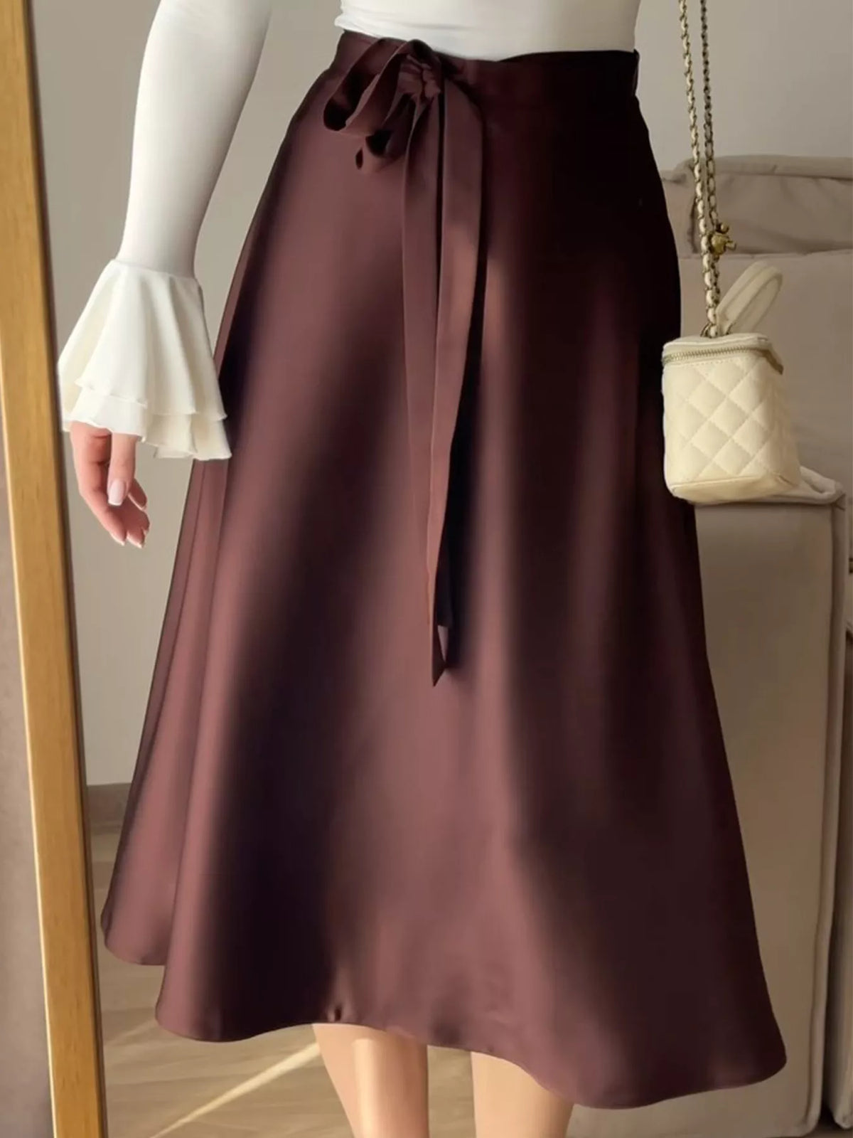 Burgundy satin A-line midi skirt with bow-tie waistband