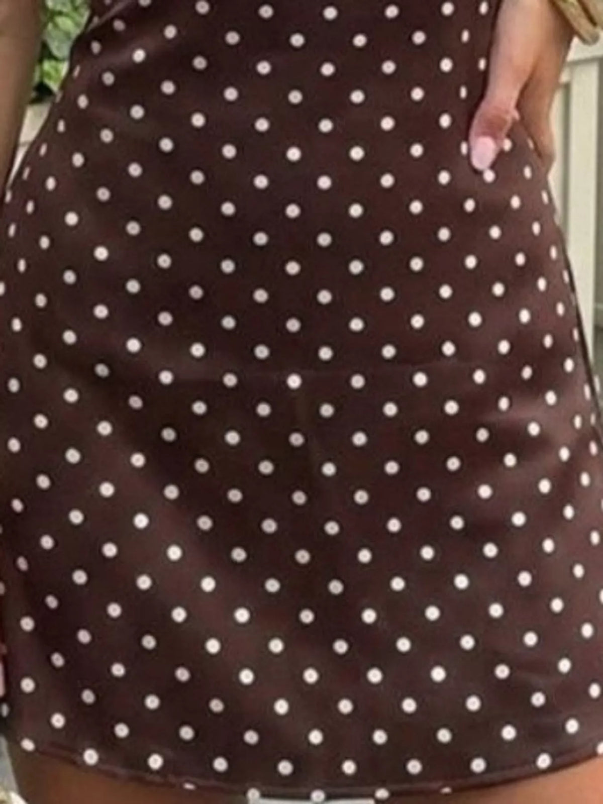 Brown polka-dot bodycon mini dress with sleeveless halter style