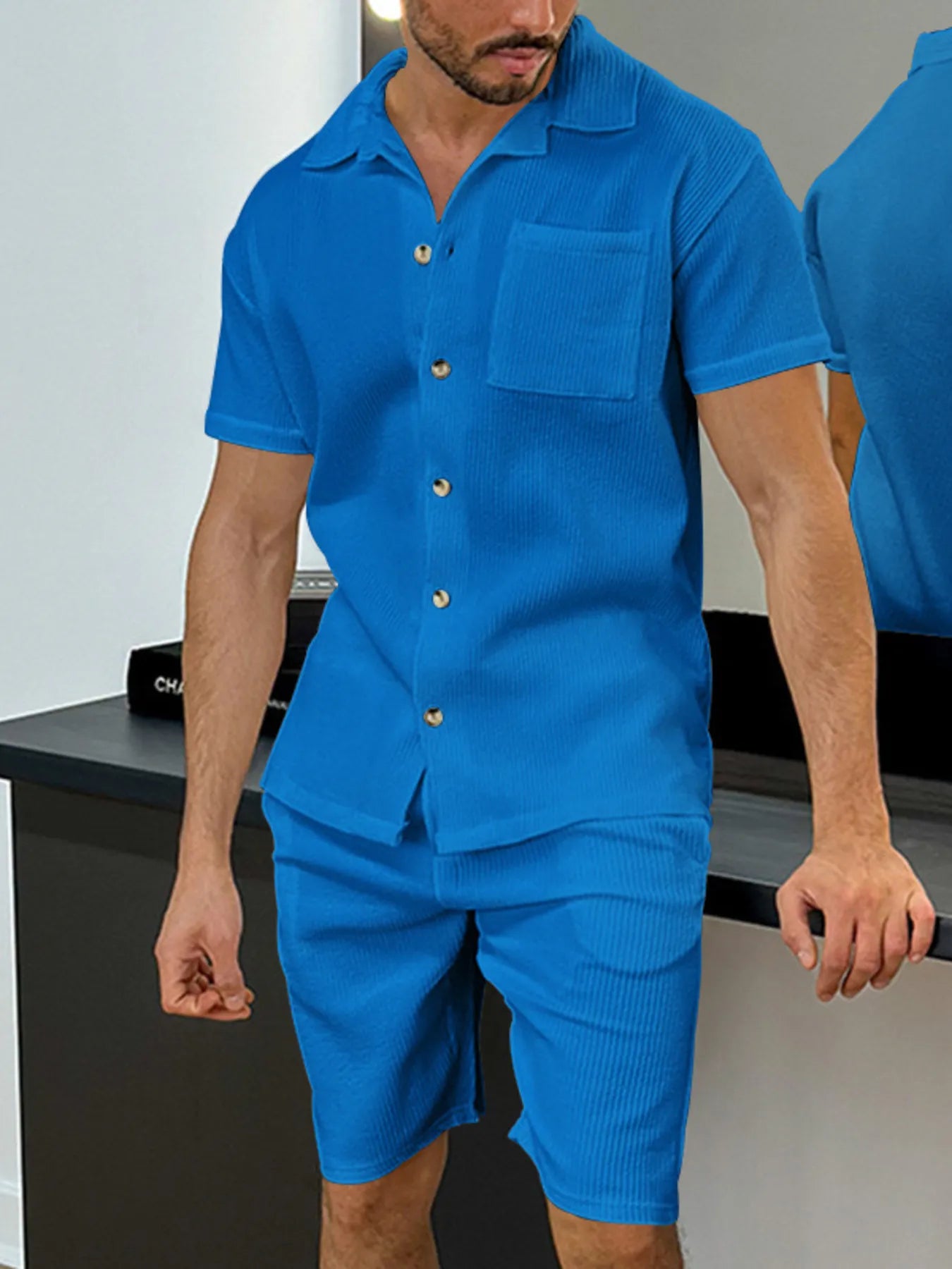 Men's blue button-up short-sleeve shirt with chest pocket and matching shorts
