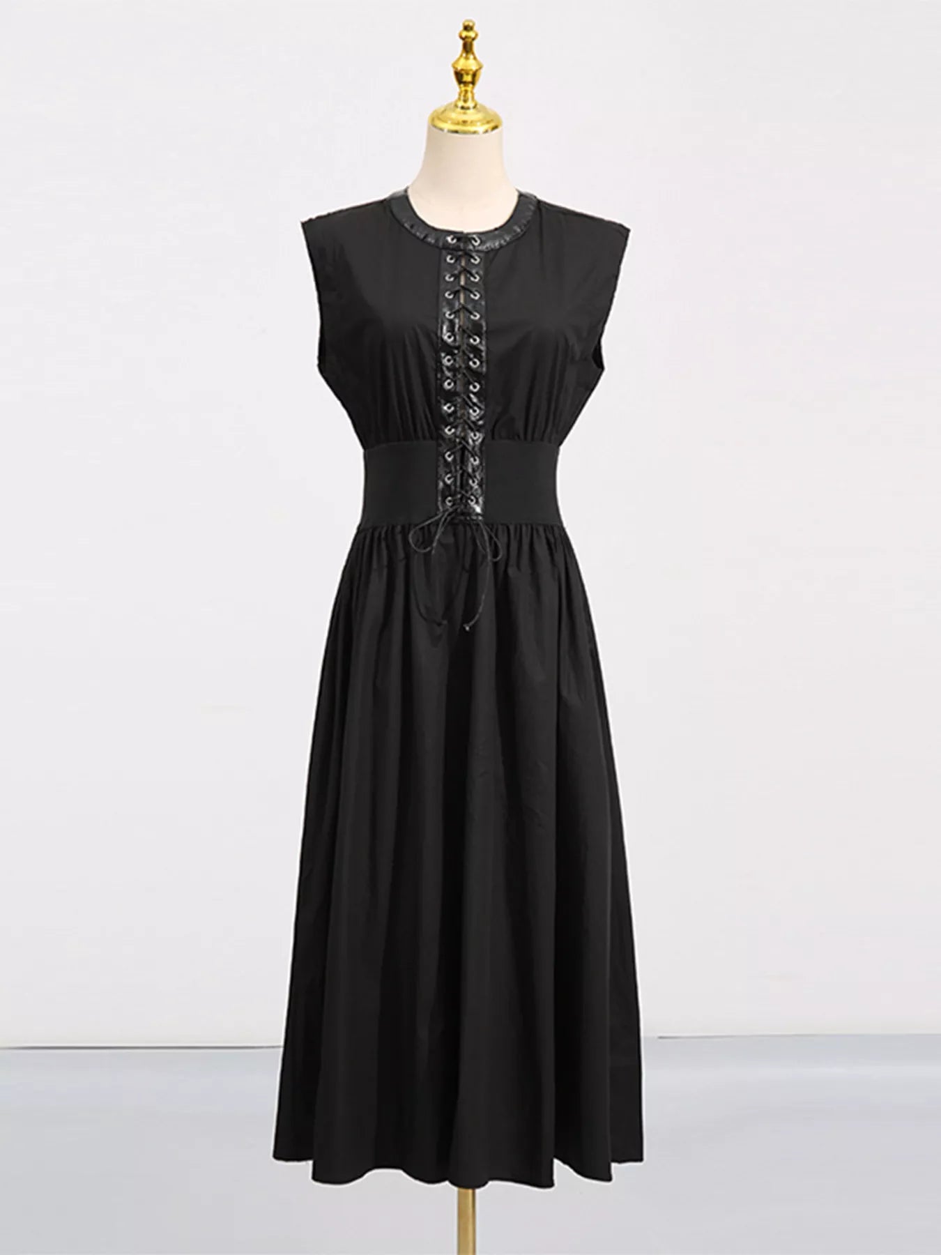 Cedar & Moore Lace-Up Corset Sleeveless Midi Dress in black by Trendsi with pockets.